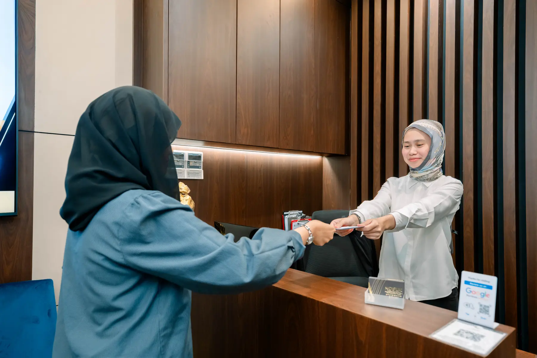 NOVUX reception team welcoming a client