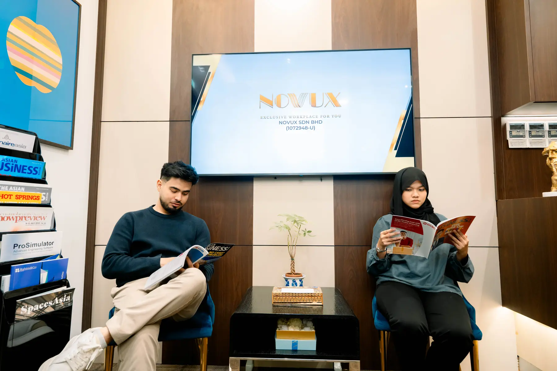 Professionals using the NOVUX client lounge in Kuala Lumpur